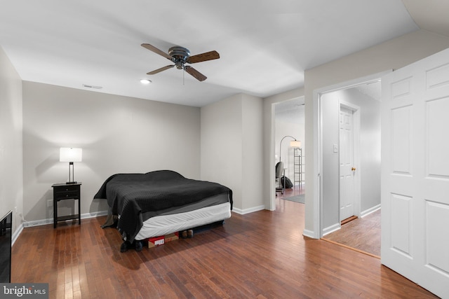 bedroom featuring baseboards, recessed lighting, ceiling fan, and wood finished floors
