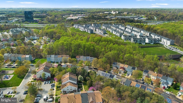 bird's eye view featuring a view of trees and a residential view