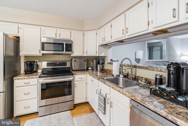 602 Lions Gate Ln, Odenton, MD 21113 - kitchen with white cabinetry, stainless steel appliances, and a sink