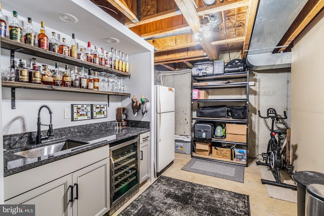 602 Lions Gate Ln, Odenton, MD 21113 - bar with beverage cooler, indoor wet bar, a sink, freestanding refrigerator, and concrete flooring