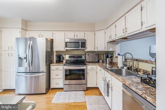 602 Lions Gate Ln, Odenton, MD 21113 - kitchen with white cabinetry, stainless steel appliances, and a sink