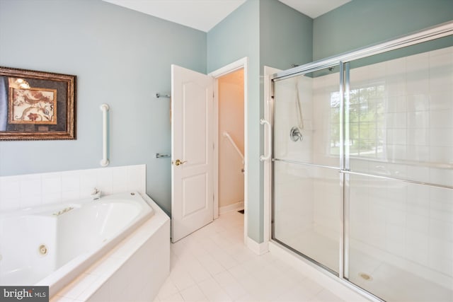 full bath featuring a tub with jets, tile patterned floors, and a shower stall