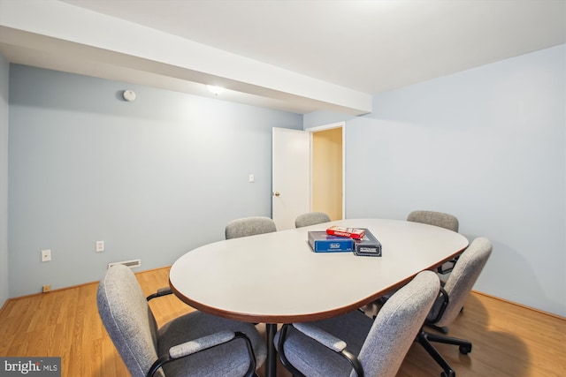 dining space featuring visible vents and light wood finished floors