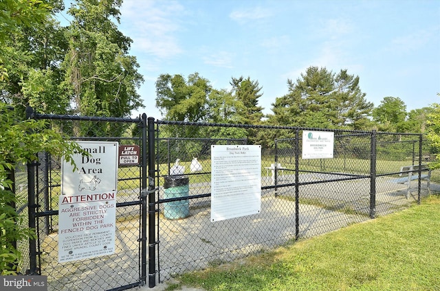 exterior space featuring a gate and fence