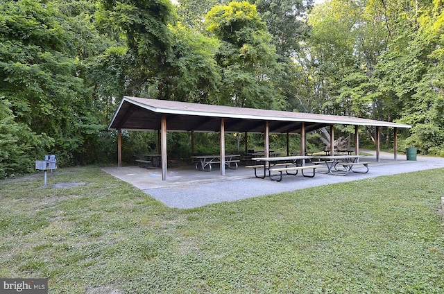 view of property's community featuring a lawn and a gazebo