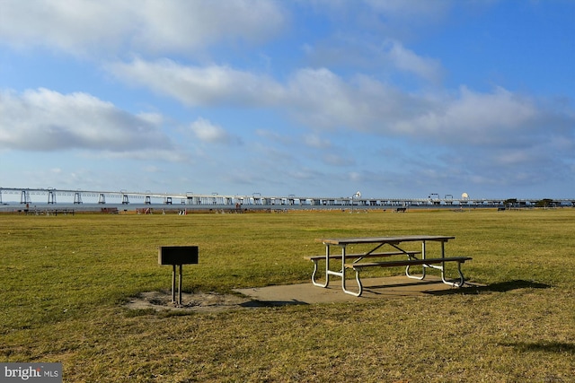view of home's community with a yard
