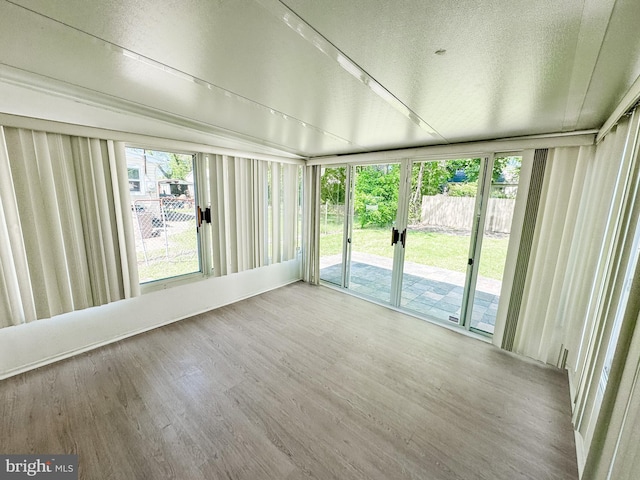 21 Onaway Pl, New Castle, DE 19720 - unfurnished sunroom featuring a textured ceiling and wood finished floors