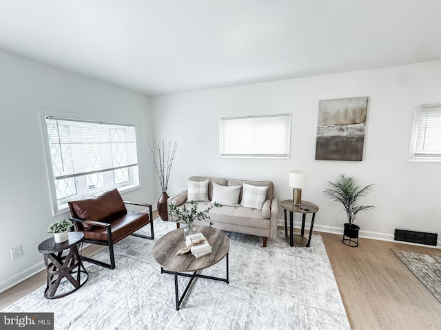 21 Onaway Pl, New Castle, DE 19720 - living room with baseboards, wood finished floors, and visible vents