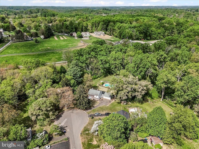 bird's eye view featuring a forest view