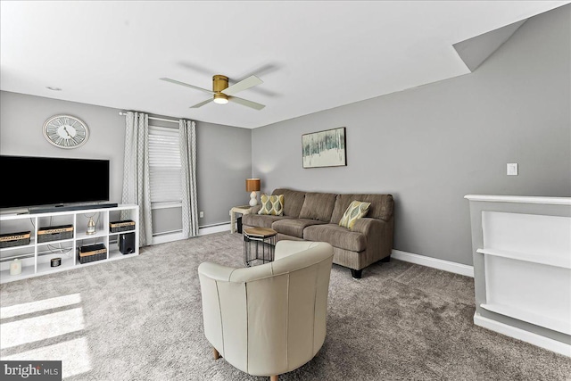 living area with carpet floors, baseboards, and ceiling fan