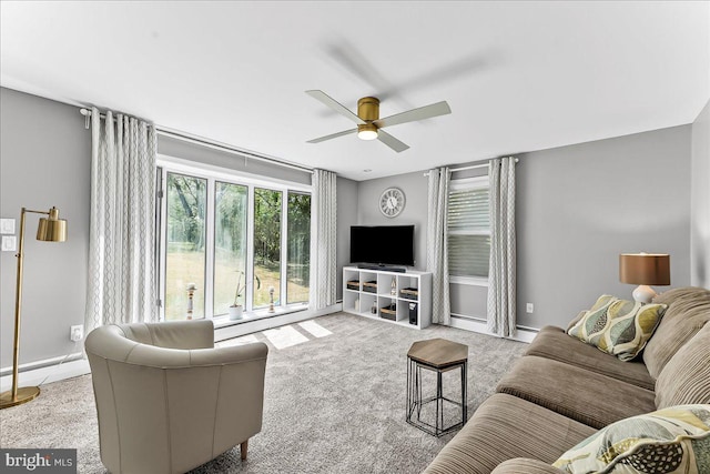 living room with carpet flooring and ceiling fan