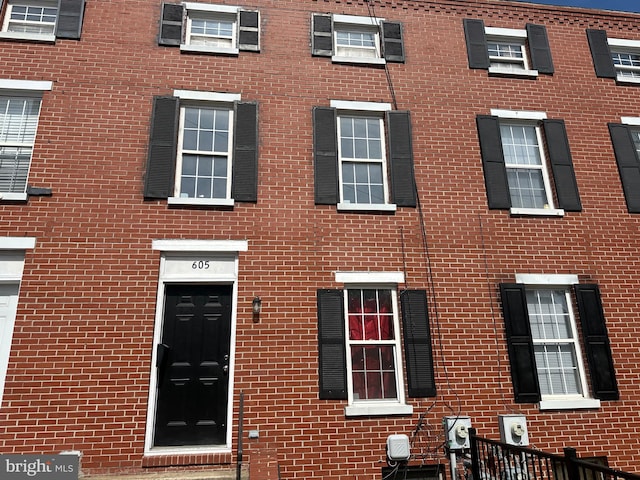 view of front of house with brick siding