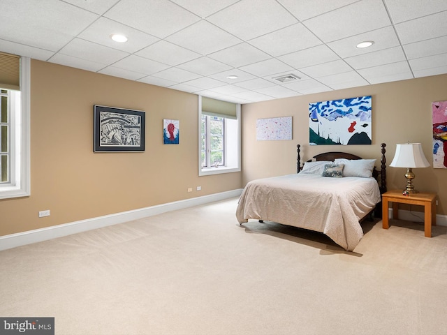 carpeted bedroom with visible vents, recessed lighting, baseboards, and a drop ceiling