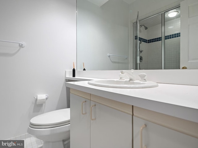 bathroom featuring vanity, tile patterned floors, toilet, and a shower stall