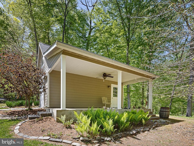 exterior space featuring a porch and a ceiling fan