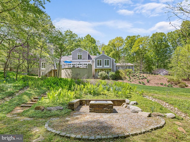 exterior space with a fire pit