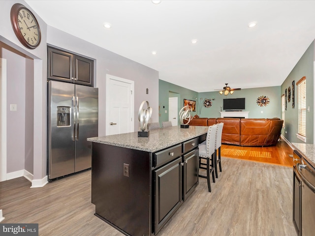 2004 Quandary Dr, Frederick, MD 21702 - kitchen featuring stainless steel fridge, a ceiling fan, light wood-style floors, and light stone countertops