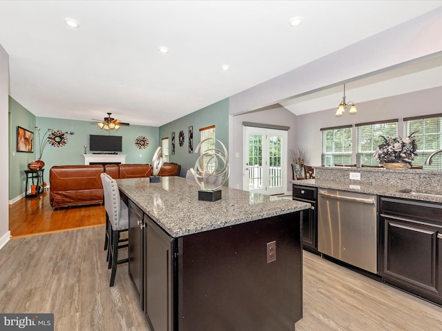 2004 Quandary Dr, Frederick, MD 21702 - kitchen featuring light wood-style floors, light stone countertops, ceiling fan with notable chandelier, and dishwasher