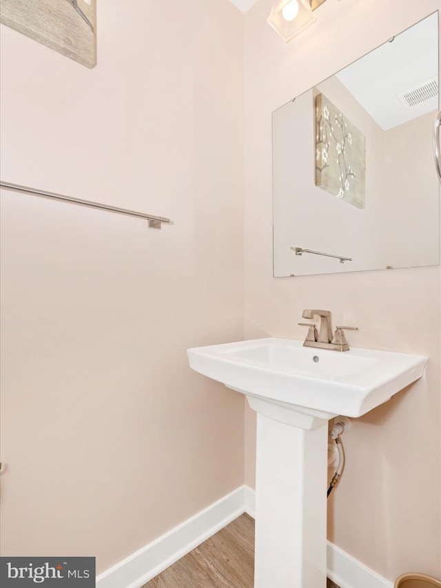 2004 Quandary Dr, Frederick, MD 21702 - bathroom with baseboards, wood finished floors, and visible vents