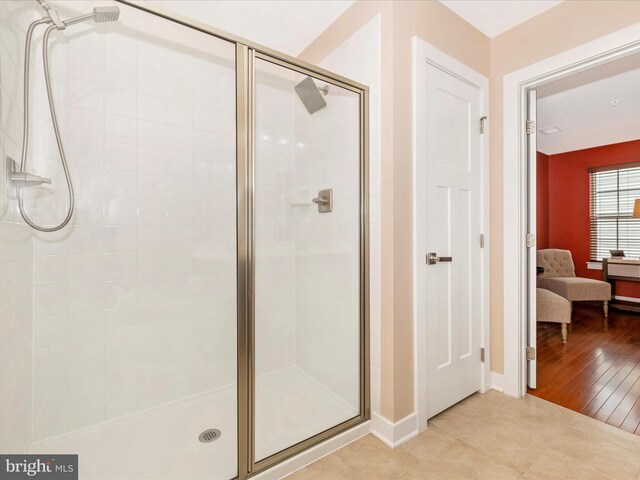 2004 Quandary Dr, Frederick, MD 21702 - bathroom with baseboards, a shower stall, tile patterned flooring, and ensuite bath