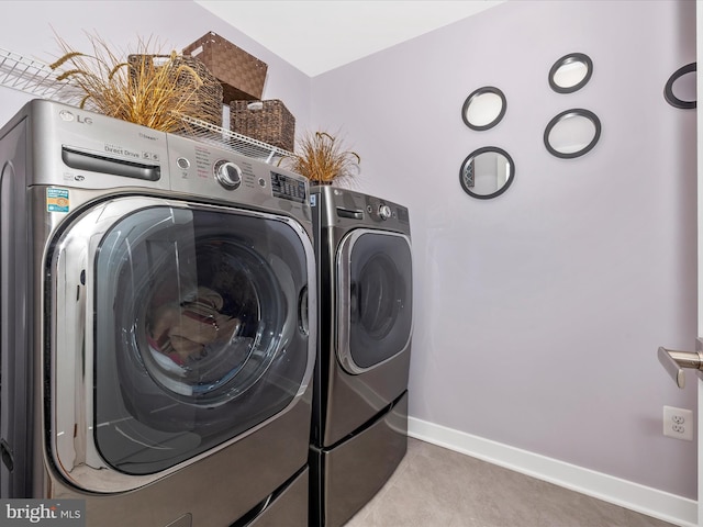 2004 Quandary Dr, Frederick, MD 21702 - laundry area with laundry area, baseboards, independent washer and dryer, and light tile patterned floors