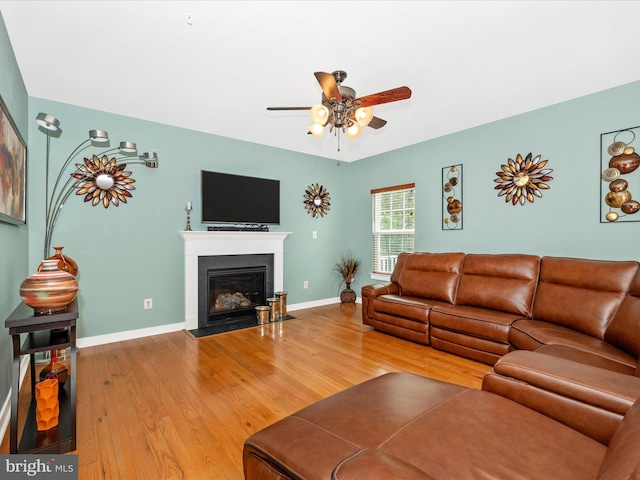2004 Quandary Dr, Frederick, MD 21702 - living room featuring a fireplace with flush hearth, baseboards, a ceiling fan, and wood finished floors