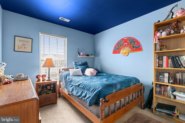 carpeted bedroom with visible vents