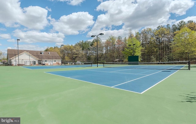 view of sport court with fence