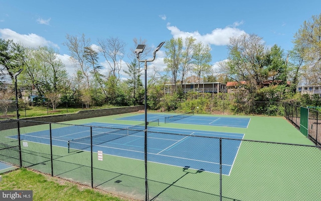 view of sport court featuring fence and community basketball court