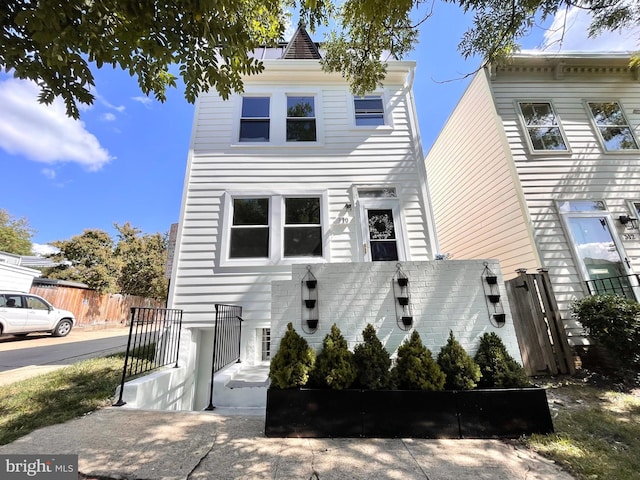 view of front of property with fence
