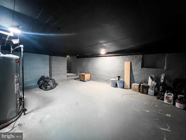 unfinished basement with water heater