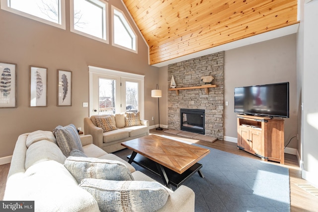 193 Greenbrier Dr, Mc Henry, MD 21541 - living room featuring wood ceiling, a fireplace, wood finished floors, high vaulted ceiling, and baseboards