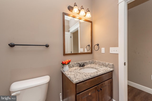 193 Greenbrier Dr, Mc Henry, MD 21541 - bathroom with vanity, baseboards, toilet, and wood finished floors