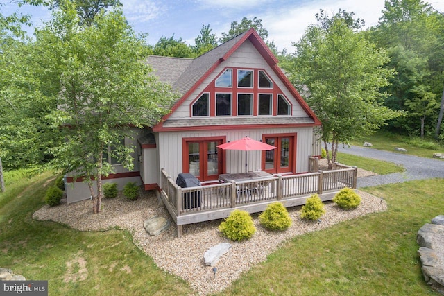 193 Greenbrier Dr, Mc Henry, MD 21541 - rear view of house featuring a lawn, french doors, and roof with shingles