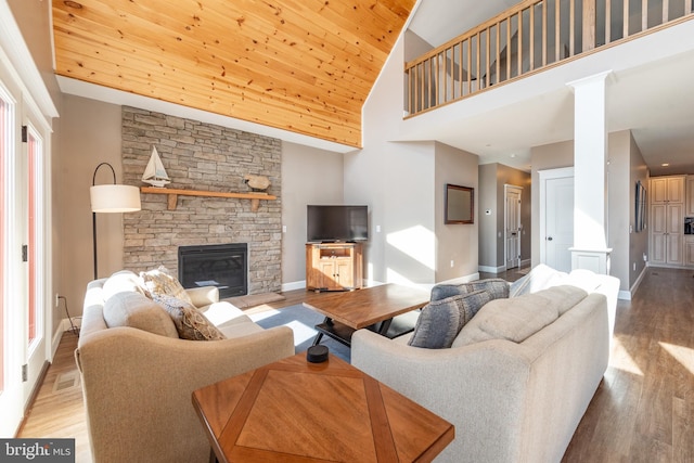 193 Greenbrier Dr, Mc Henry, MD 21541 - living room with wood finished floors, a stone fireplace, baseboards, high vaulted ceiling, and wood ceiling