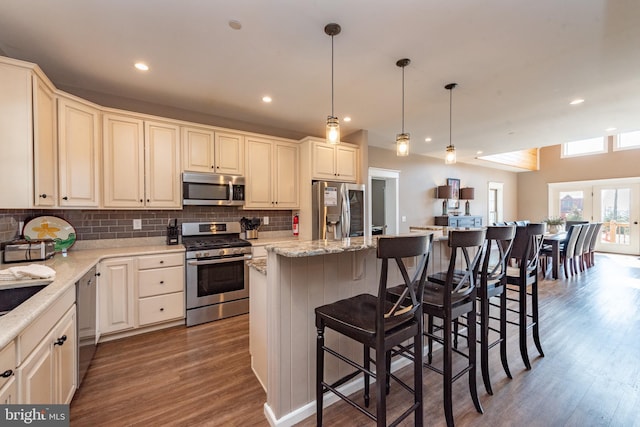 193 Greenbrier Dr, Mc Henry, MD 21541 - kitchen with a kitchen island, appliances with stainless steel finishes, tasteful backsplash, wood finished floors, and recessed lighting