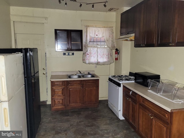kitchen featuring light countertops, under cabinet range hood, dark floors, a sink, and black appliances