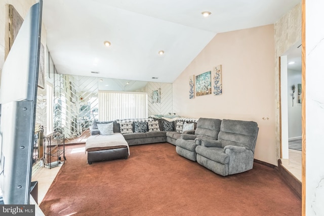 carpeted living area featuring lofted ceiling