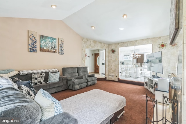 living room featuring carpet flooring, visible vents, a notable chandelier, and lofted ceiling