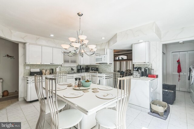 dining area with a chandelier