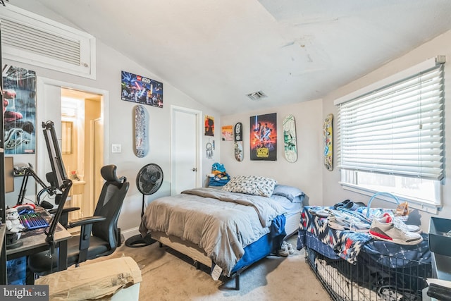 bedroom with visible vents, carpet flooring, and lofted ceiling