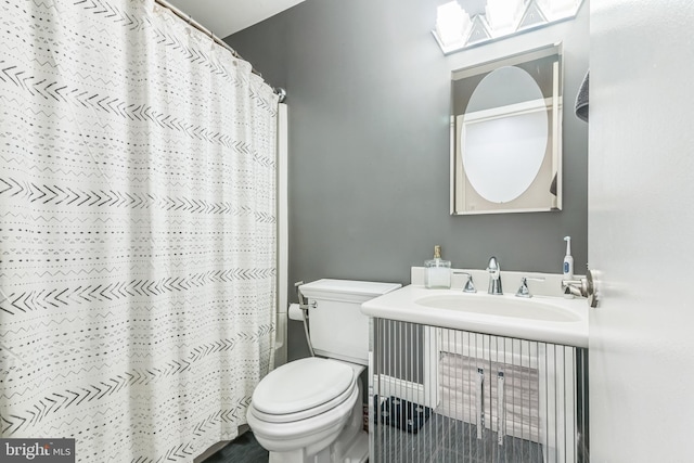 full bathroom with vanity, a shower with curtain, and toilet