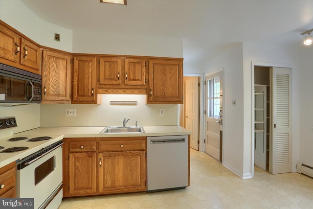 kitchen with brown cabinetry, white electric stove, black microwave, dishwasher, and a sink