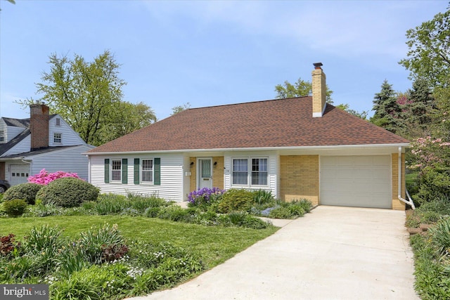 view of front of home with concrete driveway, brick siding, an attached garage, and a chimney