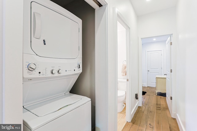 2325 W Thompson St, Philadelphia, PA 19121 - laundry room with stacked washer and dryer, laundry area, light wood-style floors, recessed lighting, and baseboards