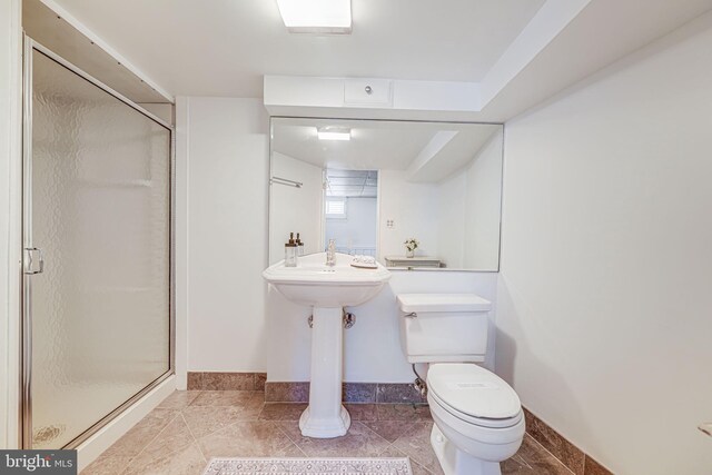 4817 Chevy Chase Blvd, Chevy Chase, MD 20815 - bathroom featuring a stall shower, toilet, baseboards, and a sink