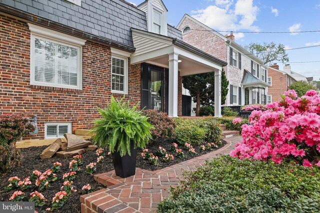 4817 Chevy Chase Blvd, Chevy Chase, MD 20815 - view of property exterior with mansard roof and brick siding