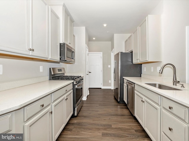 5303 Crape Myrtle Dr, Frederick, MD 21703 - kitchen featuring stainless steel appliances, a sink, dark wood-style flooring, recessed lighting, and white cabinetry