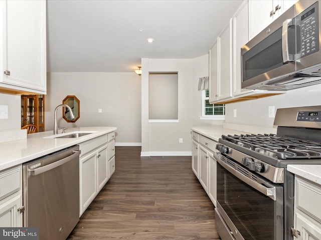 5303 Crape Myrtle Dr, Frederick, MD 21703 - kitchen with appliances with stainless steel finishes, a sink, dark wood-type flooring, white cabinetry, and recessed lighting