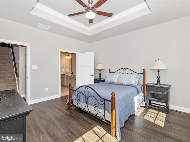 5303 Crape Myrtle Dr, Frederick, MD 21703 - bedroom with a raised ceiling, wood finished floors, baseboards, and connected bathroom